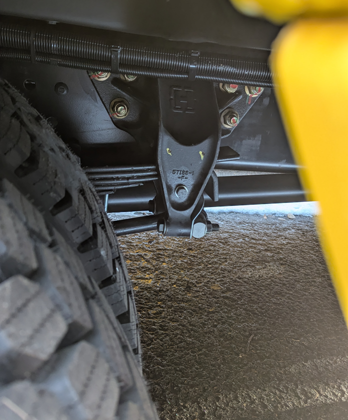 Rear leaf spring suspension front bracket